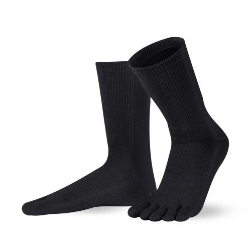 A pair of black Knitido crew-cut cotton & merino toe socks. Both socks are shown facing diagonally left against a white background with the left heel up. #color_black