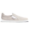 A photo of a sand canvas slip-on sneaker with white elastic on the sides, and a white sole. The right sneaker is shown from the right side against a white background. #color_sand-canvas