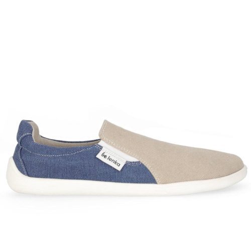 Photo 1 - A photo of Belenka Eazy slip-on sneakers made from canvas and rubber soles. The sneakers are a sand color on the toe box with white elastic, blue around the sides and back,and white soles. Right shoe is shown from the right against a white background. Photo 2 - Both shoes are shown from the top down against a white background. #color_sand-blue