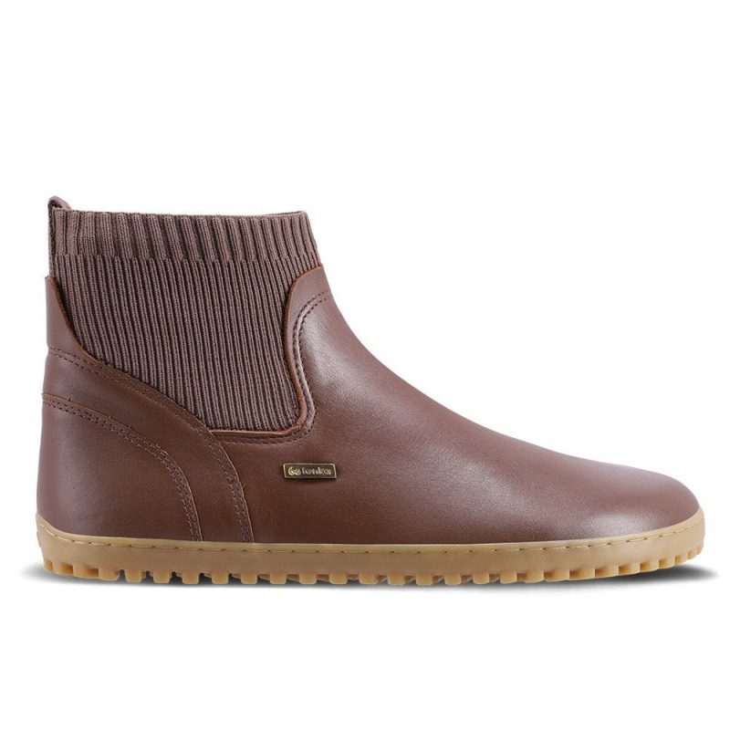 A photo of Be Lenka Mojo boots in dark brown with tan soles. Boots are made from smooth brown leather and a knit opening hugging around the ankle. Right shoe is shown from the right side against a white background. #color_dark-brown