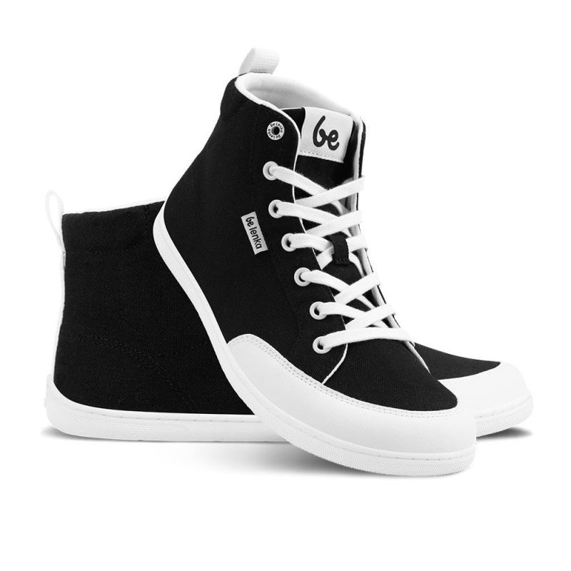 Black Be Lenka Rebound High Top sneakers with white laces, microfiber toe guards, heel accents, and rubber soles. Left shoe is facing right with the right shoe leaning up against it against a white background. #color_black-white