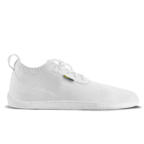 Photo 1 - White Be Lenka Stride knit sneakers with white soles. A sock-like opening is pulled on with a heel loop. Soft perforated microfiber accents the heel in a gentle hill shape. Laces are held on by a u-shaped microfiber sewn on top of the shoe. Right shoe is shown from the right side against a white background. Photo 2 - Both shoes are shown from the top down against a white background. #color_white