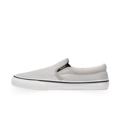 A photo of Bohempia Velik slip on sneakers made from canvas and rubber soles. The sneakers are light grey with white soles with a black stripe around the sole. The left shoe is shown from the left side on a white background. #color_light-grey-white