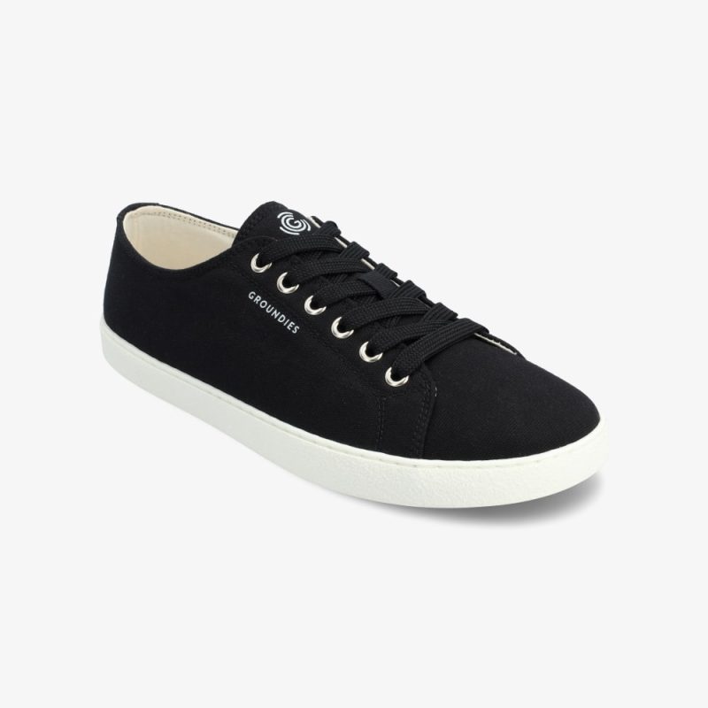 Black Groundies Lima plain cotton sneakers. Laces are black, eyelets are silver, and sole is white. Right shoe is shown here facing diagonally right against a white background. #color_black