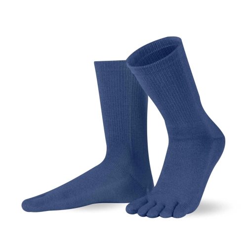 A pair of night blue Knitido crew-cut cotton & merino toe socks. Both socks are shown facing diagonally left against a white background with the left heel up. #color_night-blue