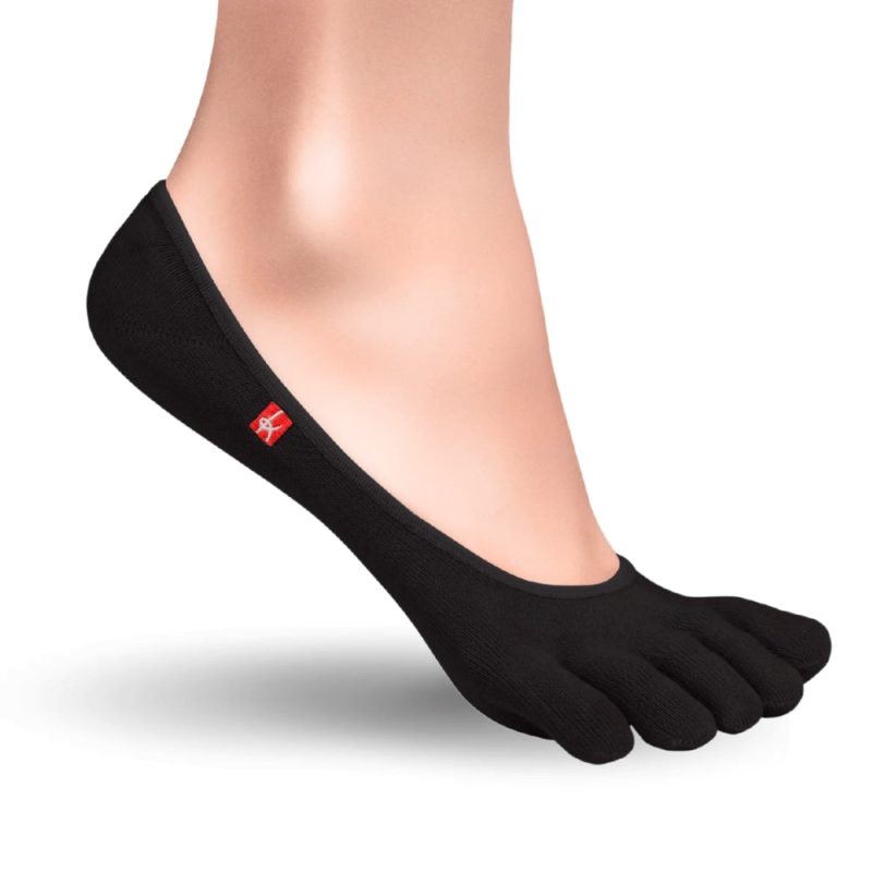 A pair of black Knitido track and trail zero toe socks. Socks are very low cut to be invisible in shoes. Right sock is shown facing right against a white background on a person with the heel up. #color_black