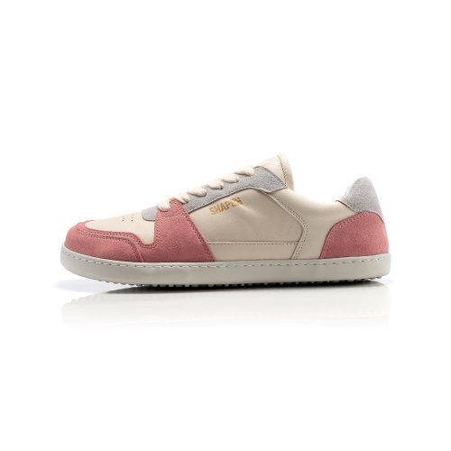 Peach Shapen ReWind leather sneakers. Shoes are a classic chunky sneaker design with light pink leather and peach suede color blocks surrounding the toe guard and heels. Light grey suede color blocks are on the perimeter of the laces and the top of the heel. Left shoe is shown facing left here against a white background. #color_peach